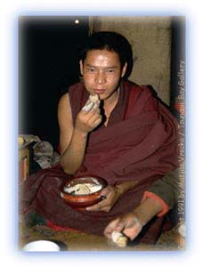 Eating Tsampa -- the staple food of Tibet. Credit: Matjaz Vrecko